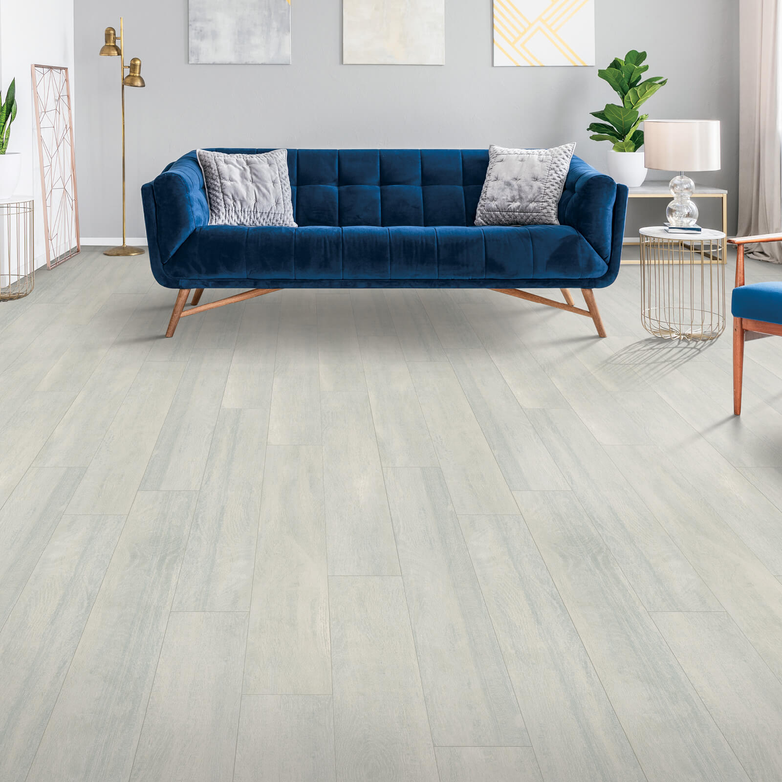 Laminate flooring with blue couch | LeClaire Flooring